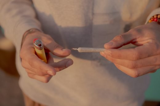 person-holding-cigarette